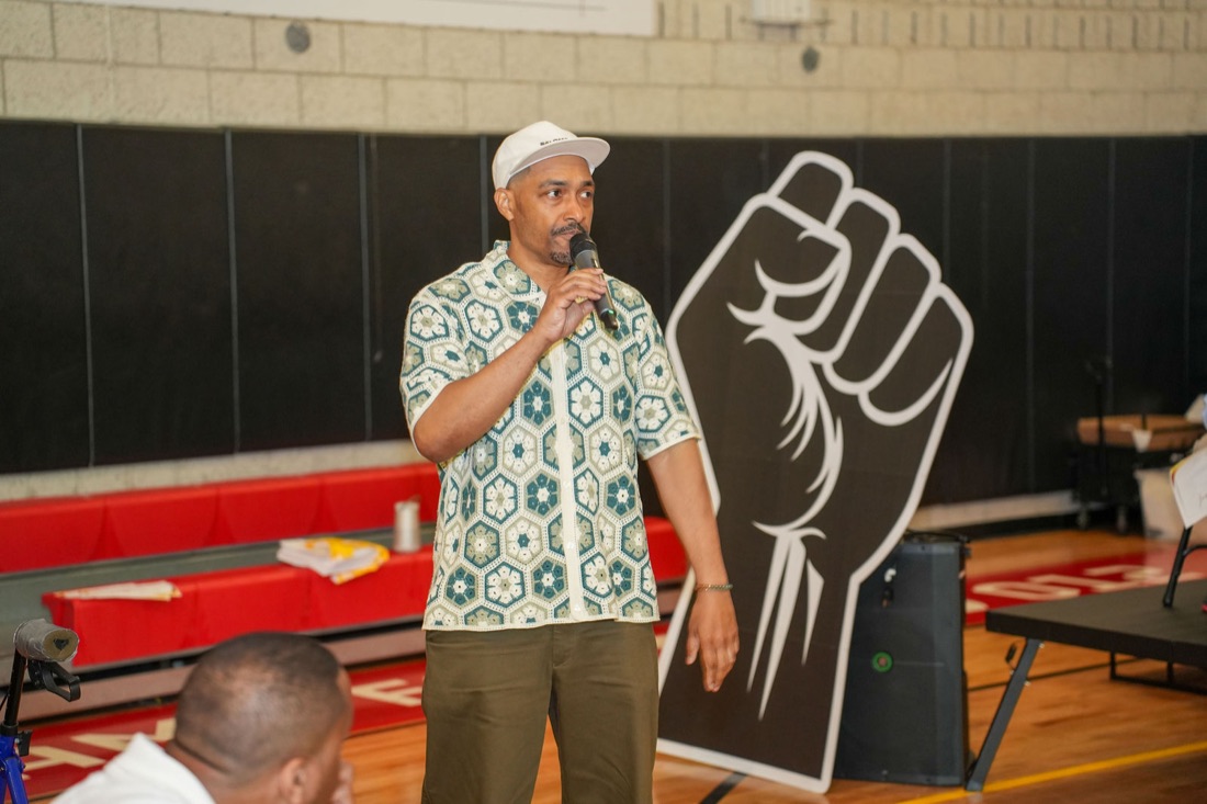 A raised-fist mural displayed at the ceremony.