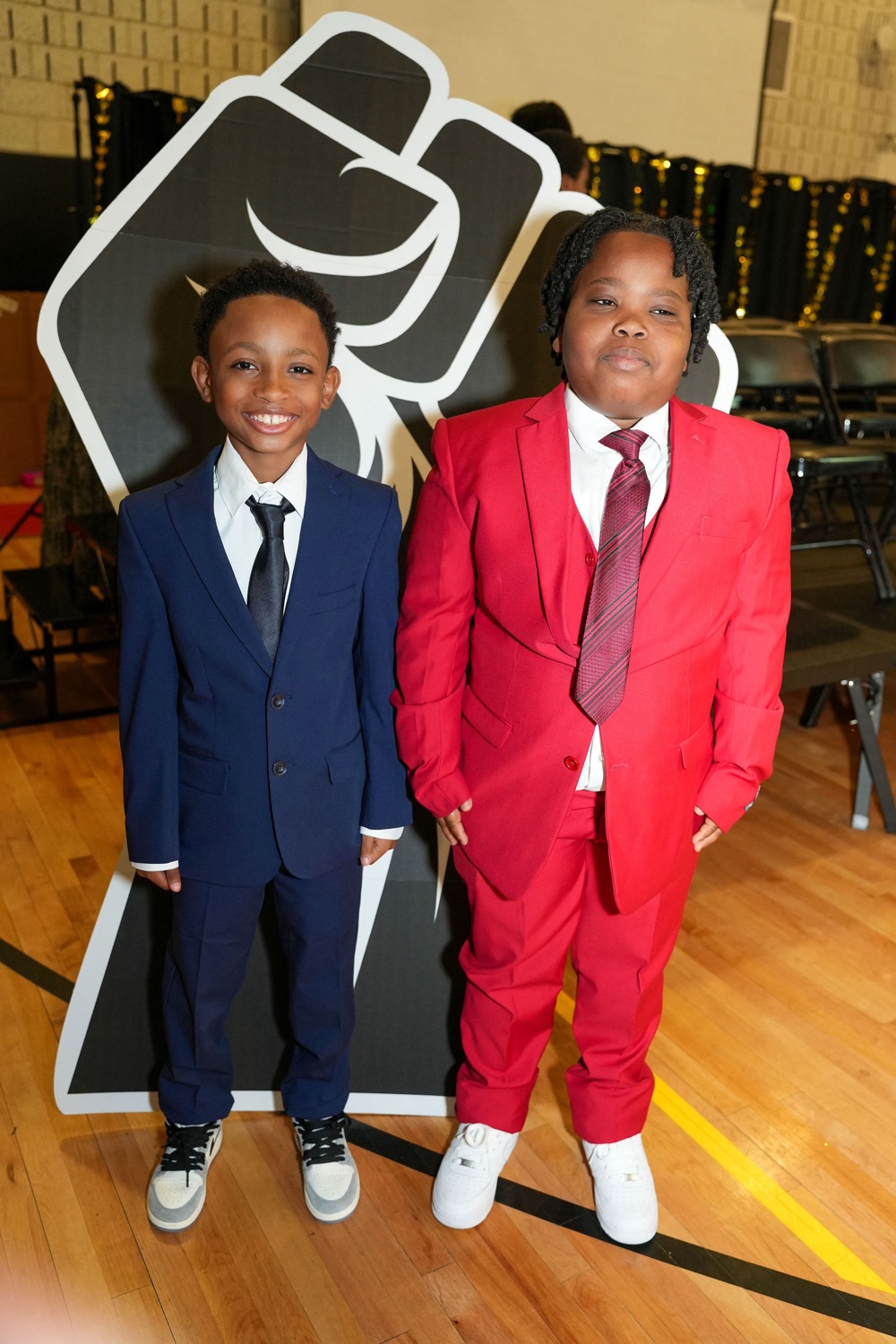 Two young inductees in their suits.